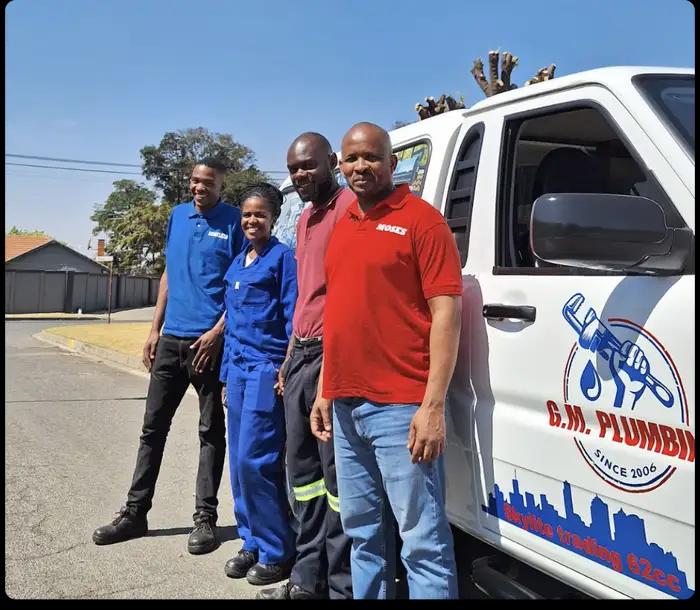 The G.M Plumbing team with their branded service van